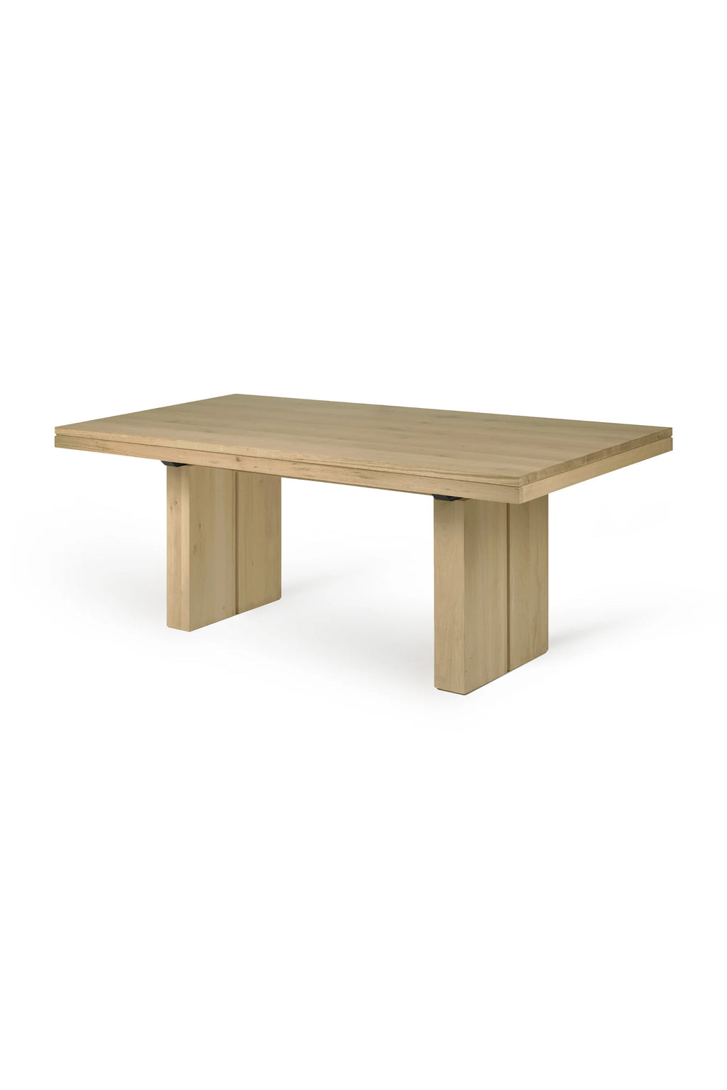 Ethnicraft Double Extendable Dining Table, a modern minimalist extendable dining table crafted from light natural solid oak wood. It features a clean rectangular tabletop with visible wood grain and two robust, chunky block legs, offering a contemporary and sturdy design. This versatile blonde wood dining table is perfect for modern dining rooms or spacious kitchen areas, ideal for both everyday use and entertaining guests.