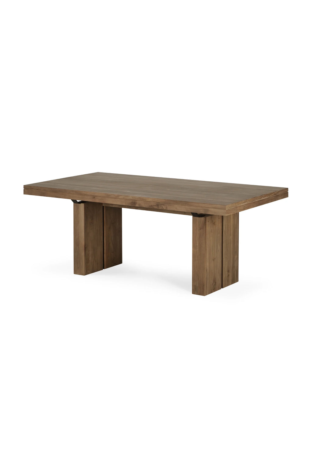 Ethnicraft Double Extendable Dining Table, a robust contemporary dining table crafted from solid natural wood with a warm brown finish and visible grain. This rectangular extendable dining table features thick, minimalist block-style legs and a seamless extension mechanism, offering versatility for large gatherings. Perfect as a centerpiece in a modern minimalist dining room, rustic modern kitchen, or spacious open-plan living area.
