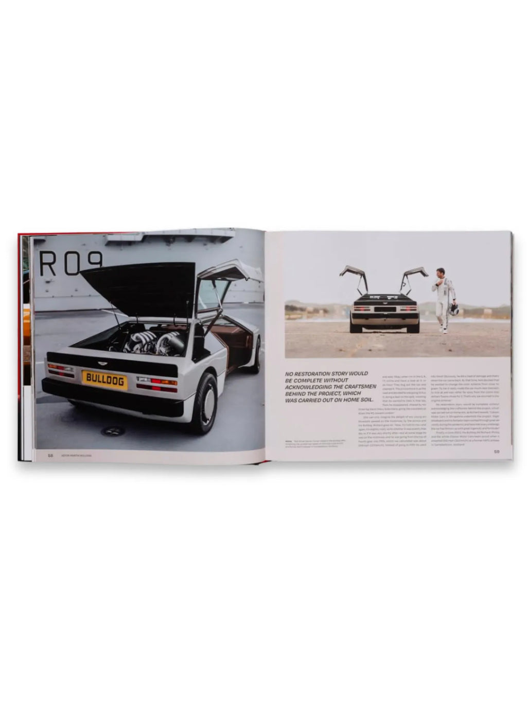 Book Drive Different, an open book displaying glossy pages featuring classic car photography and text. The left page shows a detailed rear view of a white "Bulldog" concept car with its engine bay open, while the right page features a rear view of a black classic car with gull-wing doors open, standing beside a driver in a white racing suit in a desert landscape. This premium automotive book is an ideal gift for car enthusiasts and collectors of unique vehicle histories.