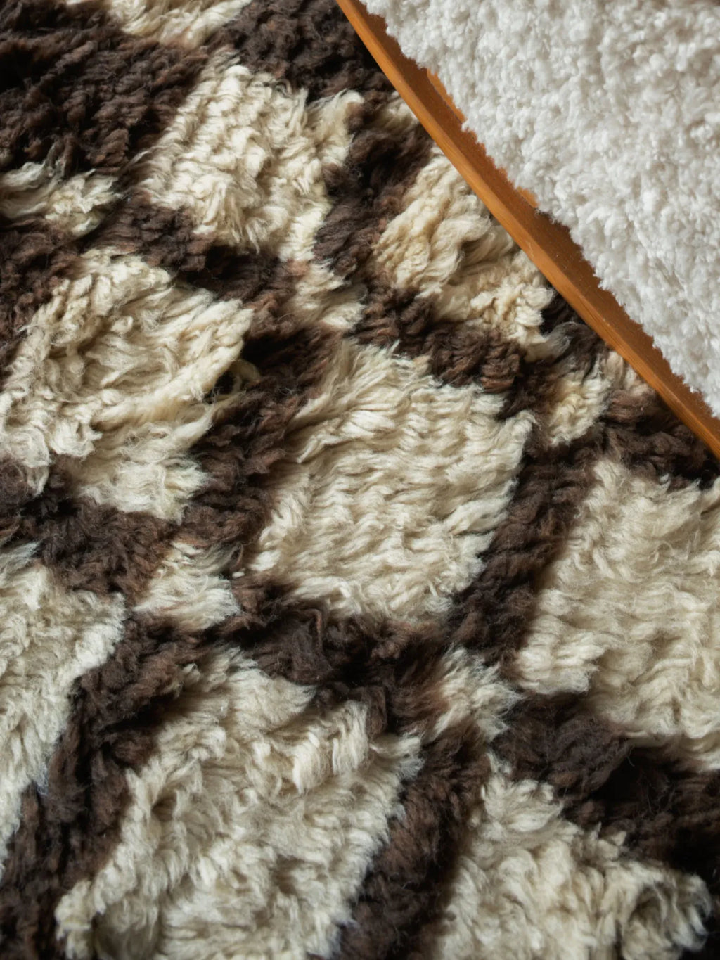 Layered Chestnut Shaggy Rug, a close-up of a luxurious, high-pile area rug featuring a plush, soft texture with alternating cream and dark brown abstract patterns. Perfect for adding warmth and boh...