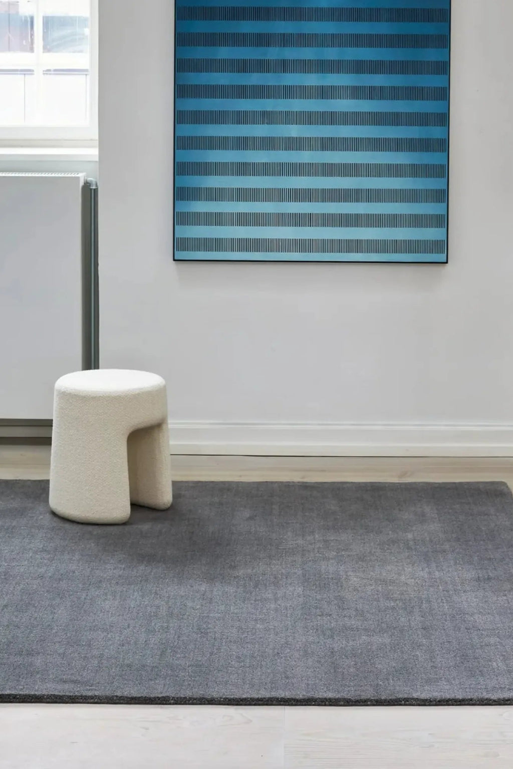 Hand-woven jute rug with natural earthy tones and textured pattern