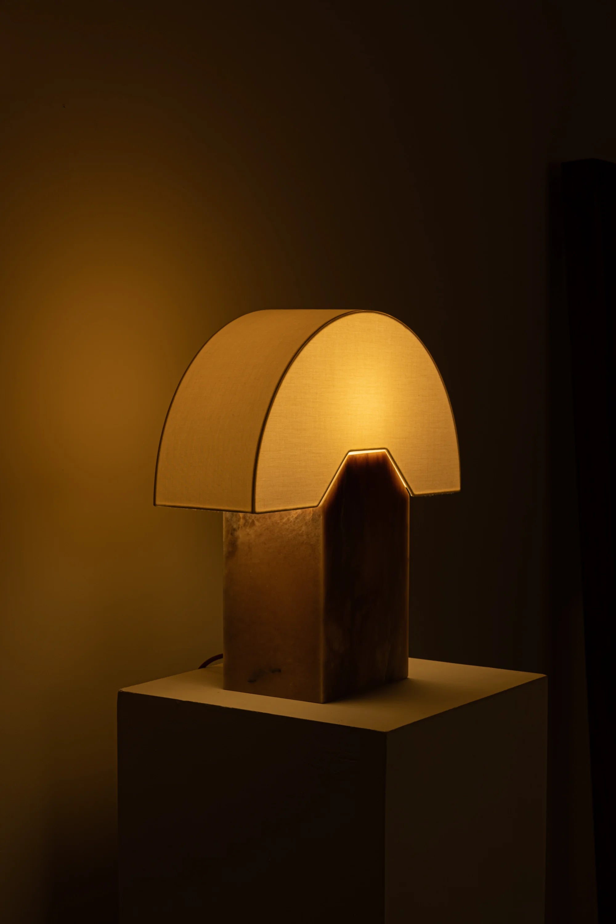 Table lamp with a warm glow on a dark background