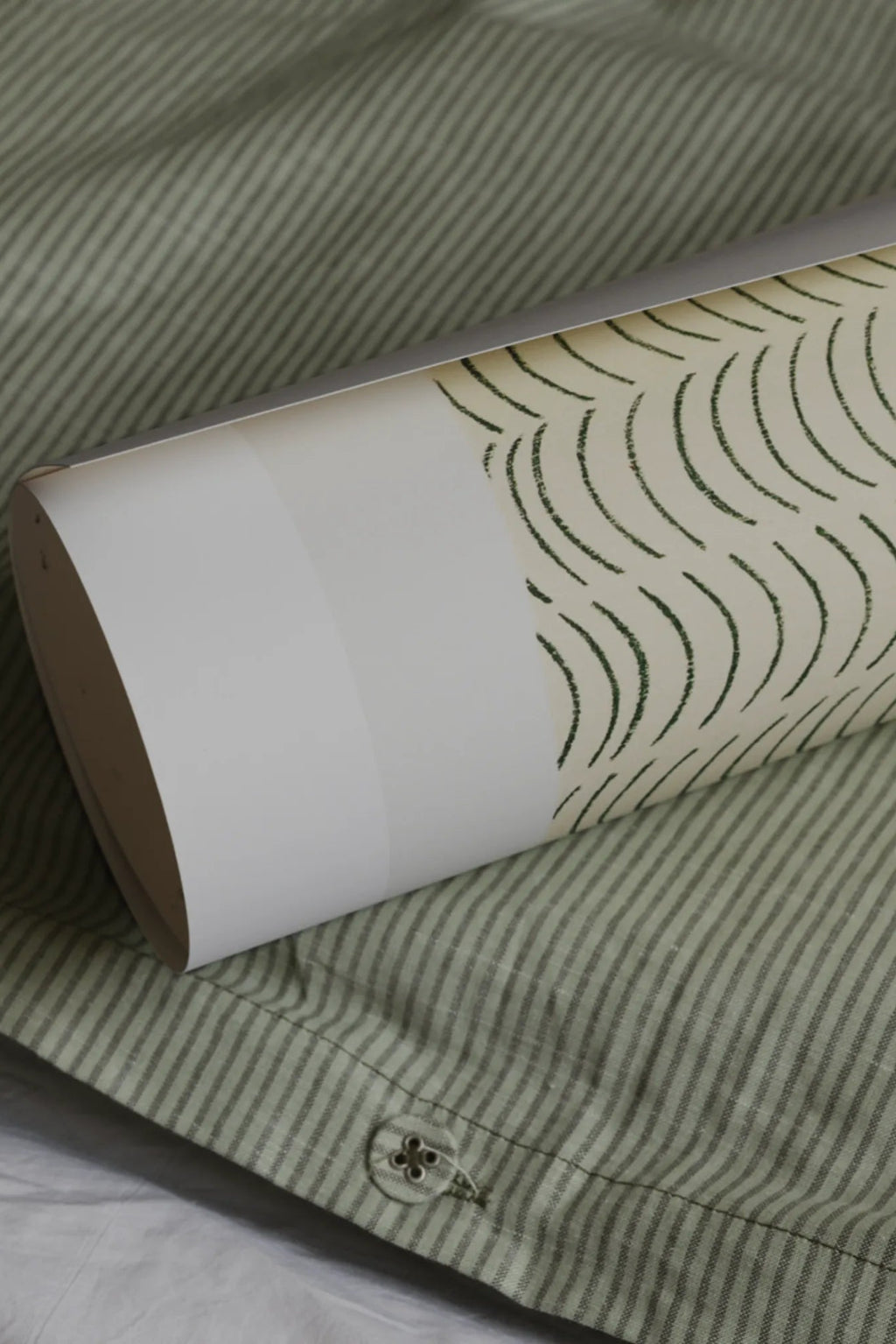 The Poster Club Something to Keep, a minimalist abstract art print featuring a repeating pattern of hand-drawn dark green arched lines on a warm cream-colored background, printed on high-quality art paper.