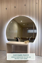  Close-up of Half-Moon Mirror With Warm White Lights 