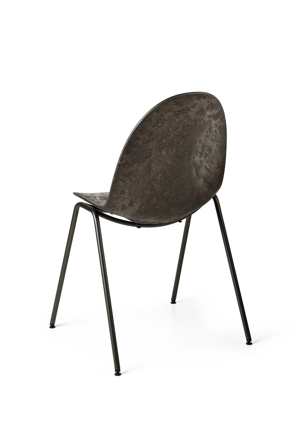 Mater Eternity Sidechair, seen from a three-quarter rear view, in a dark, textured finish, revealing the elegant curve of the backrest and the splayed black metal legs, on a white background.