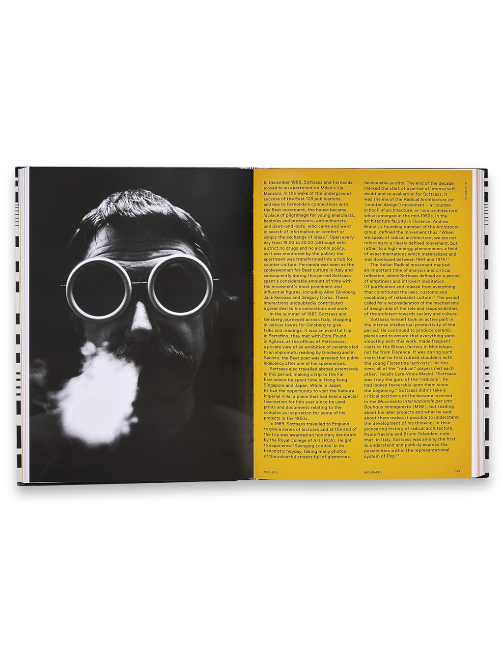 Book Ettore Sottsass, a premium art and design book open to a page featuring a striking black and white portrait of a man with a mustache wearing round, thick-rimmed goggles, exhaling a cloud of smoke. This engaging biography offers insightful content for design enthusiasts and art history students.