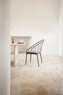 Modern black iron dining chair with sleek design and comfortable cushioning