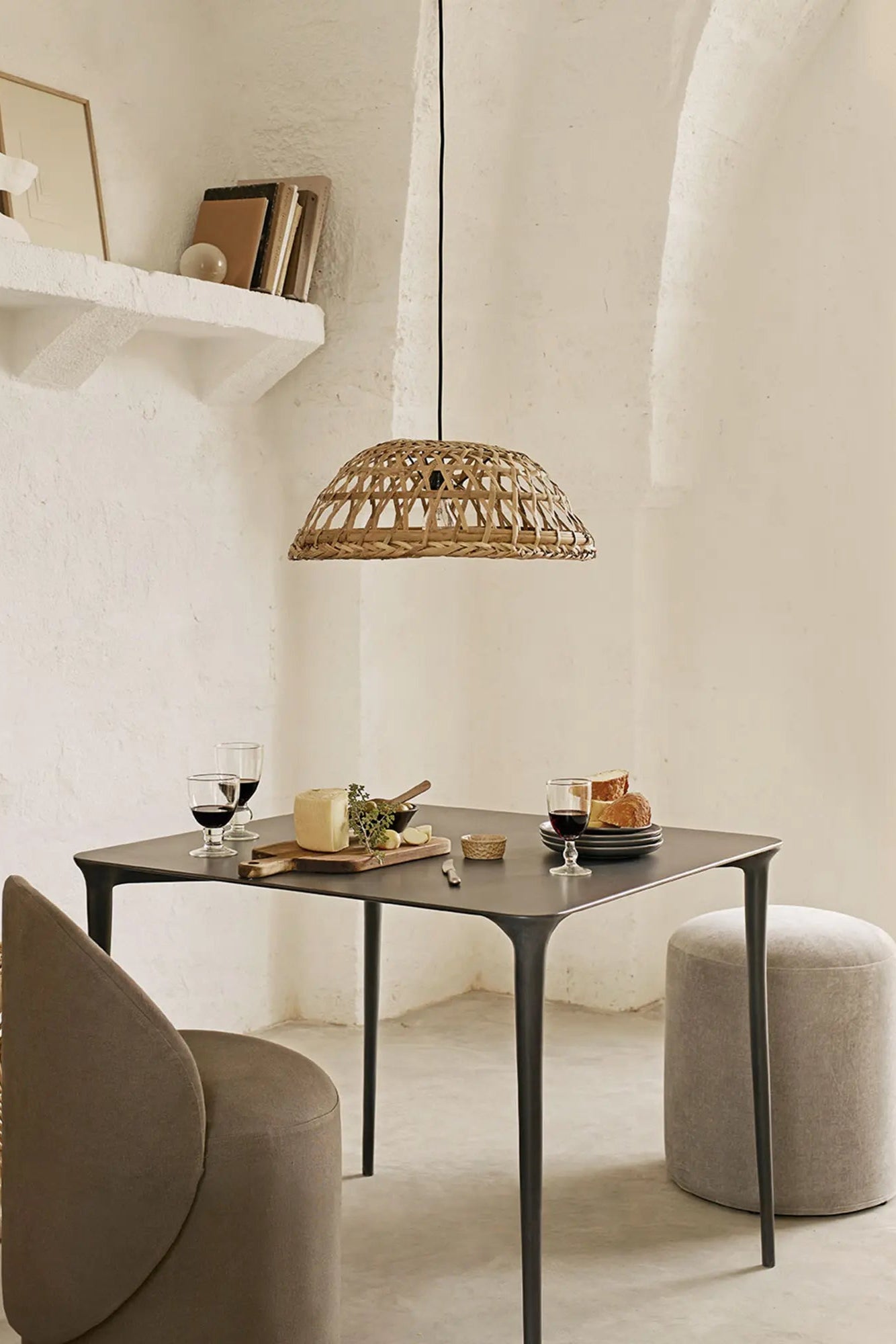Modern metal dining table with industrial-inspired design and wood top