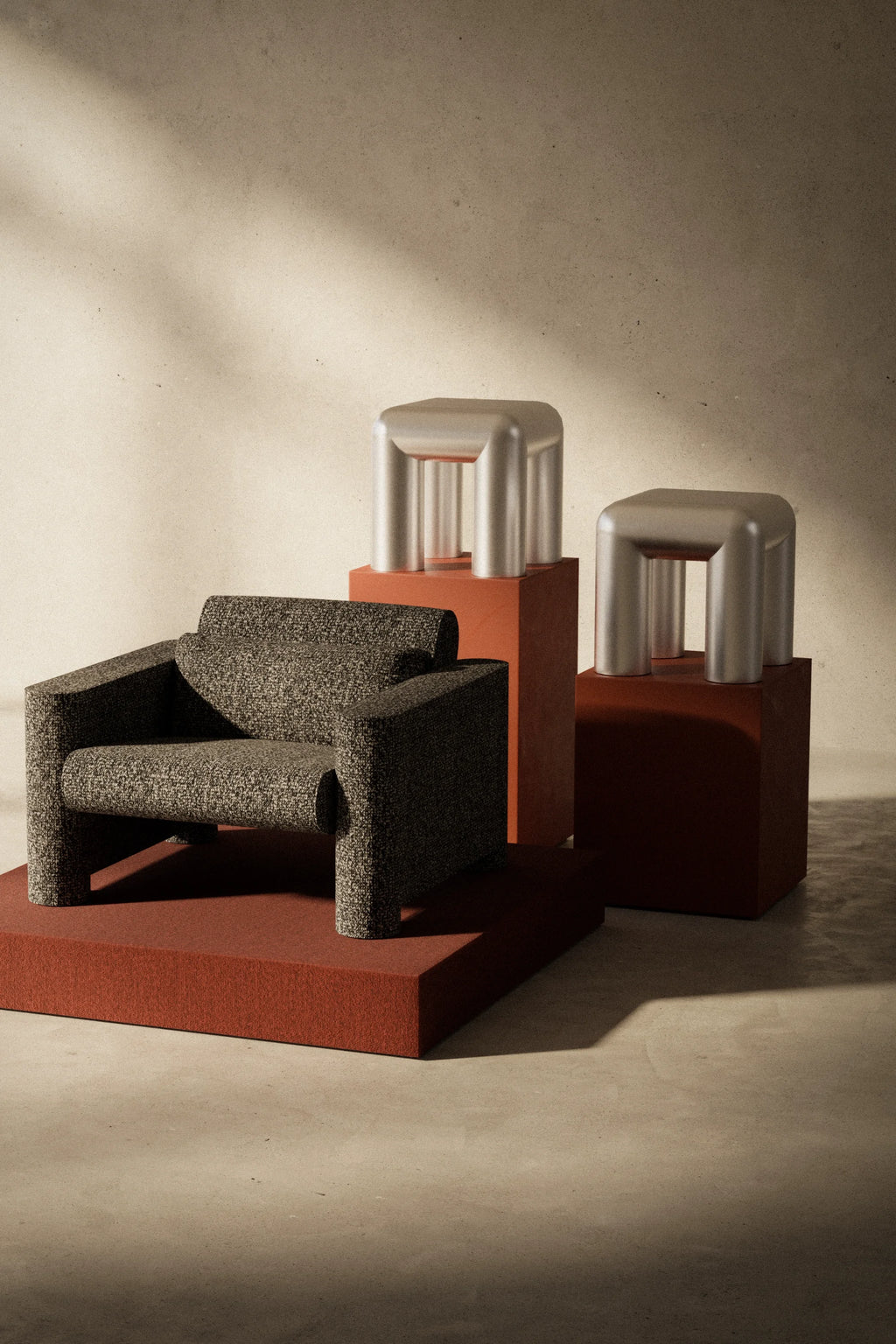 Modern chair and stools on a textured floor with a neutral wall background