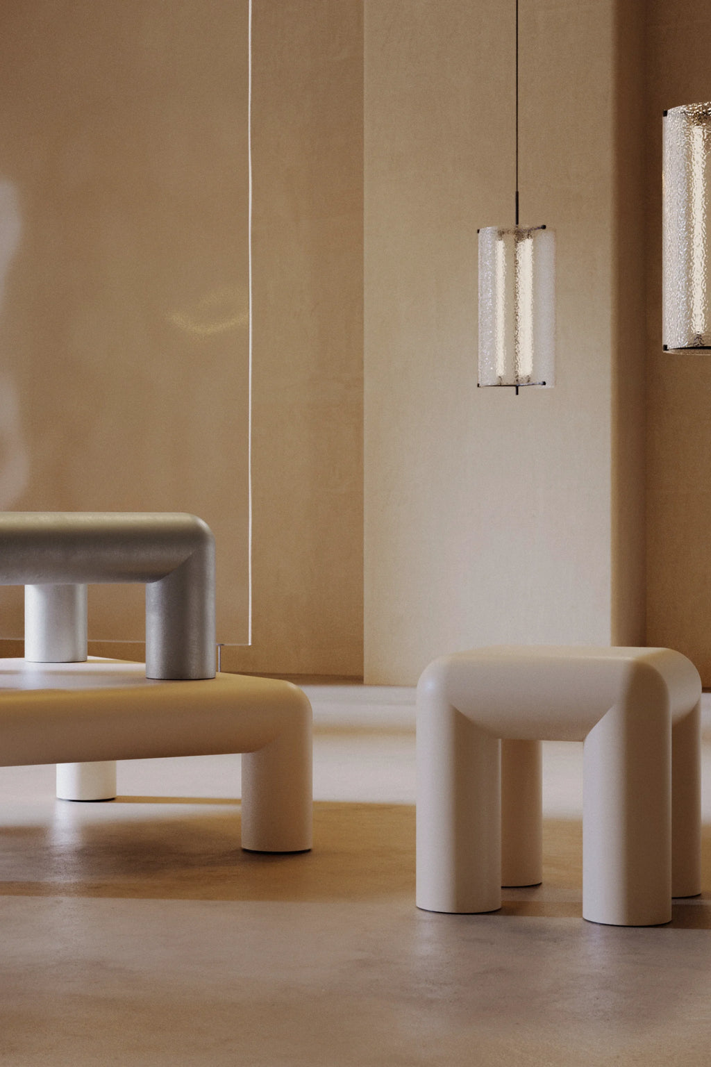 Modern white stools in a minimalistic room with neutral walls and flooring.