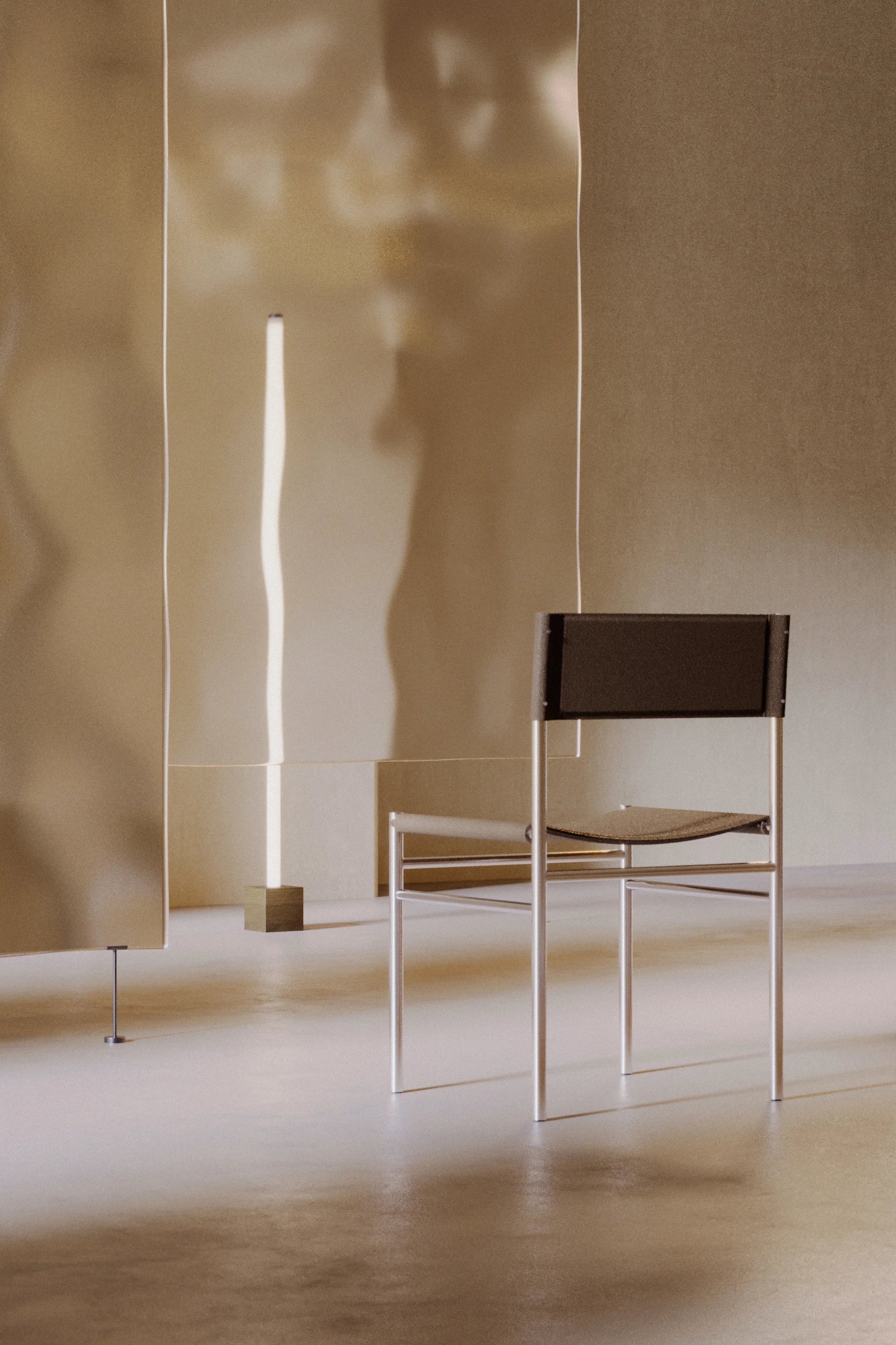 Modern chair with a brown seat and backrest against a neutral wall.