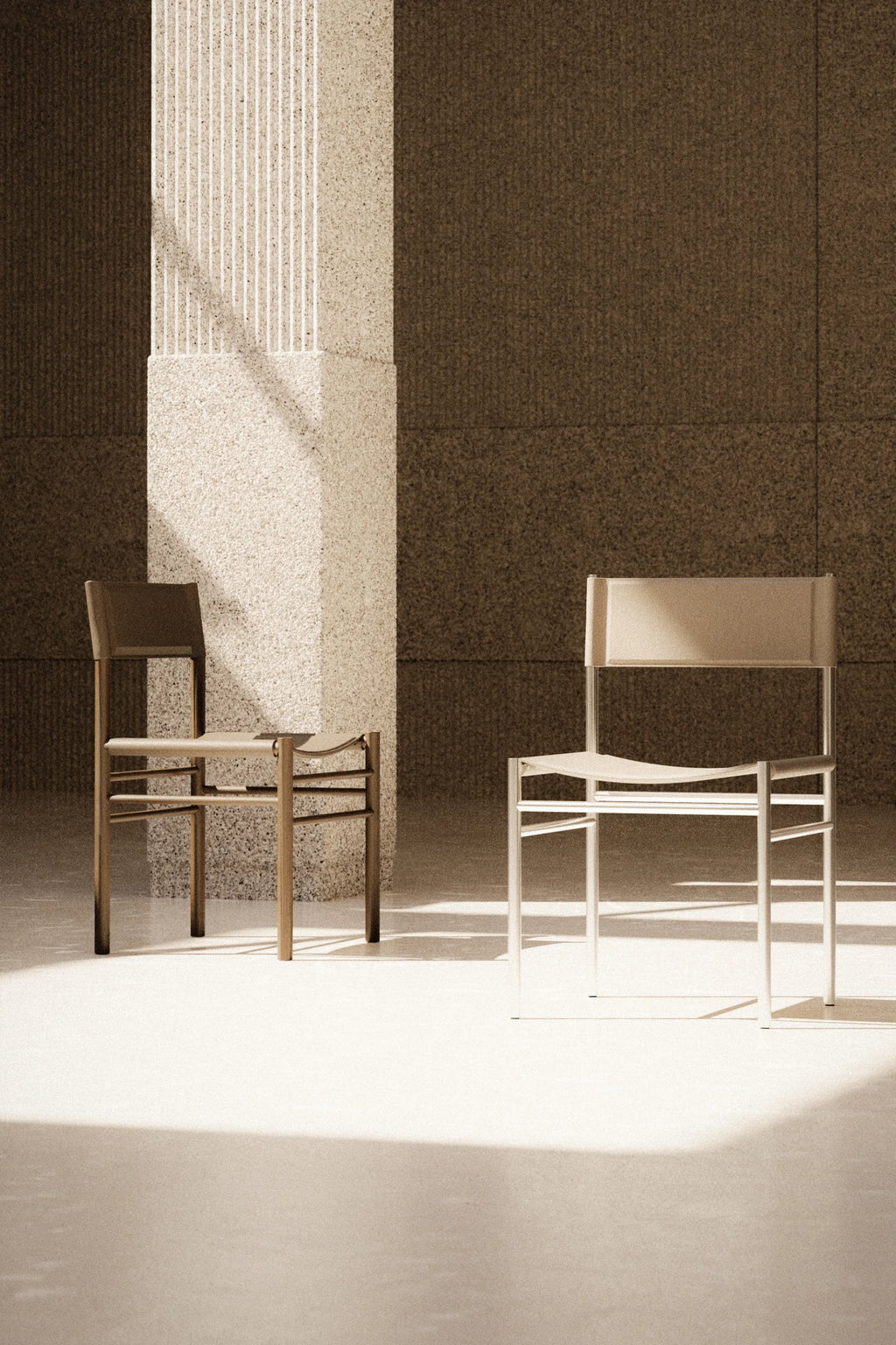 Two chairs in a minimalistic setting with a textured wall and light source.