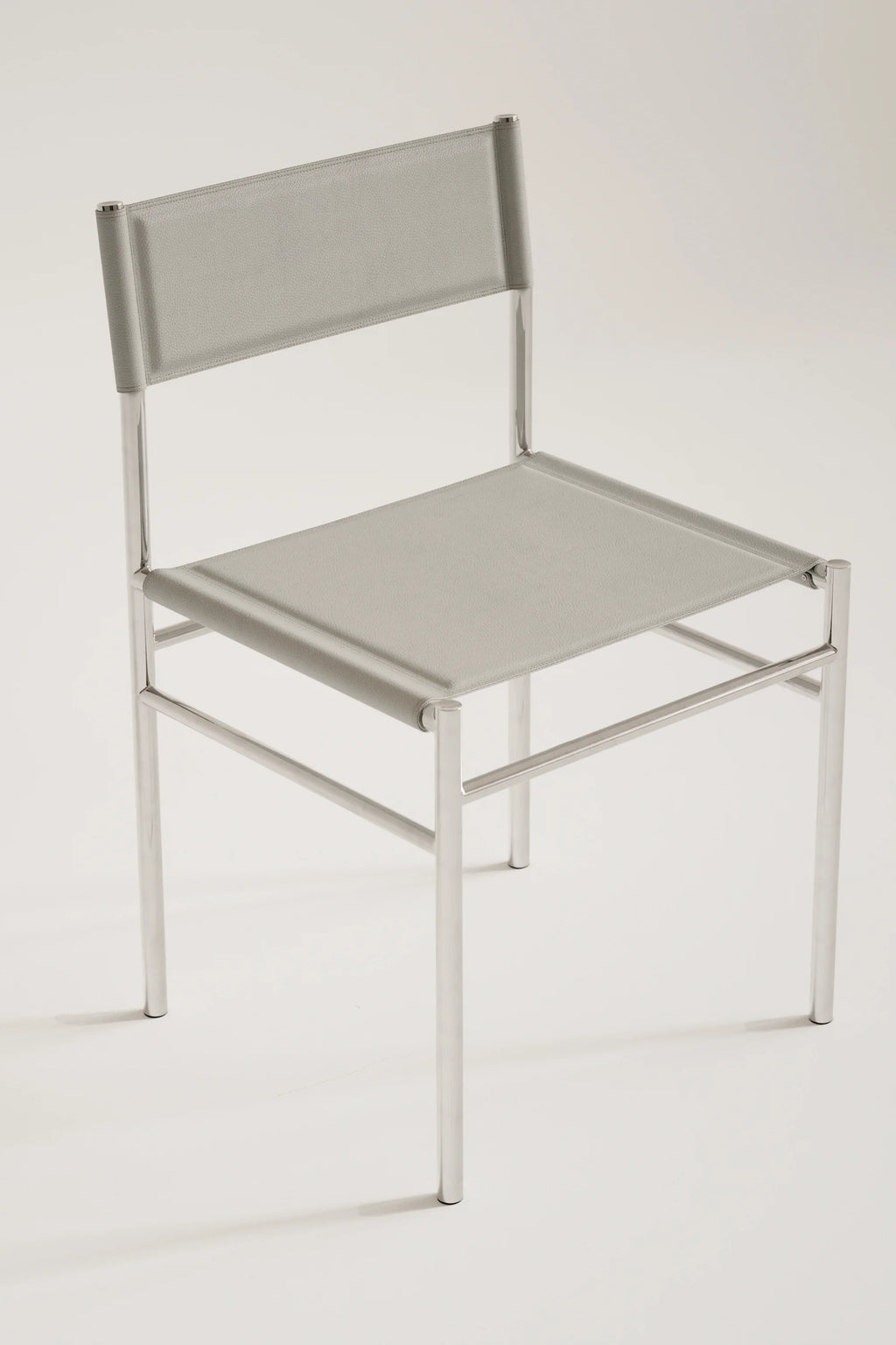 Light gray chair with metal frame on a white background