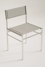 Light gray chair with metal frame on a white background