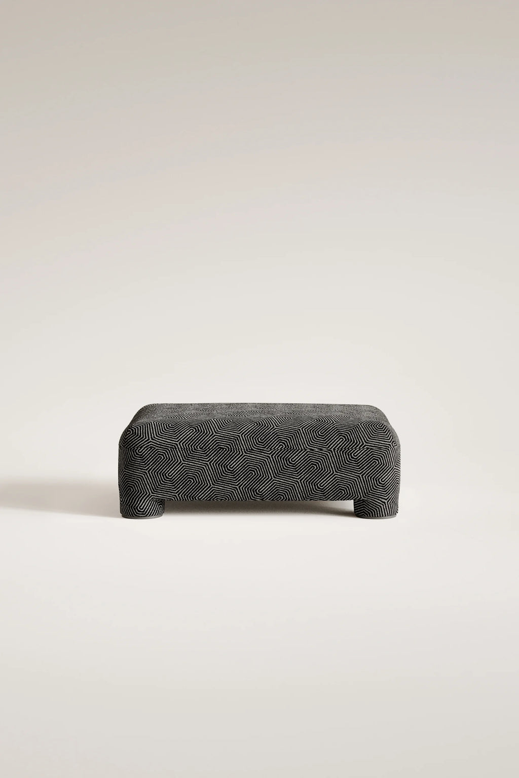 Textured ottoman on a light beige background