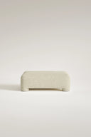 Beige ottoman on a light beige background