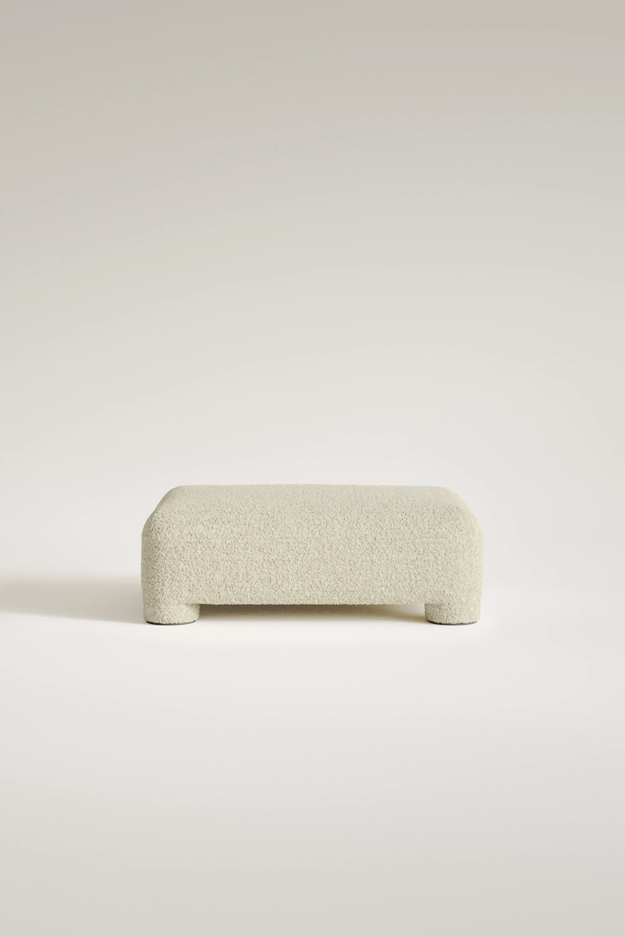 Beige ottoman on a light beige background
