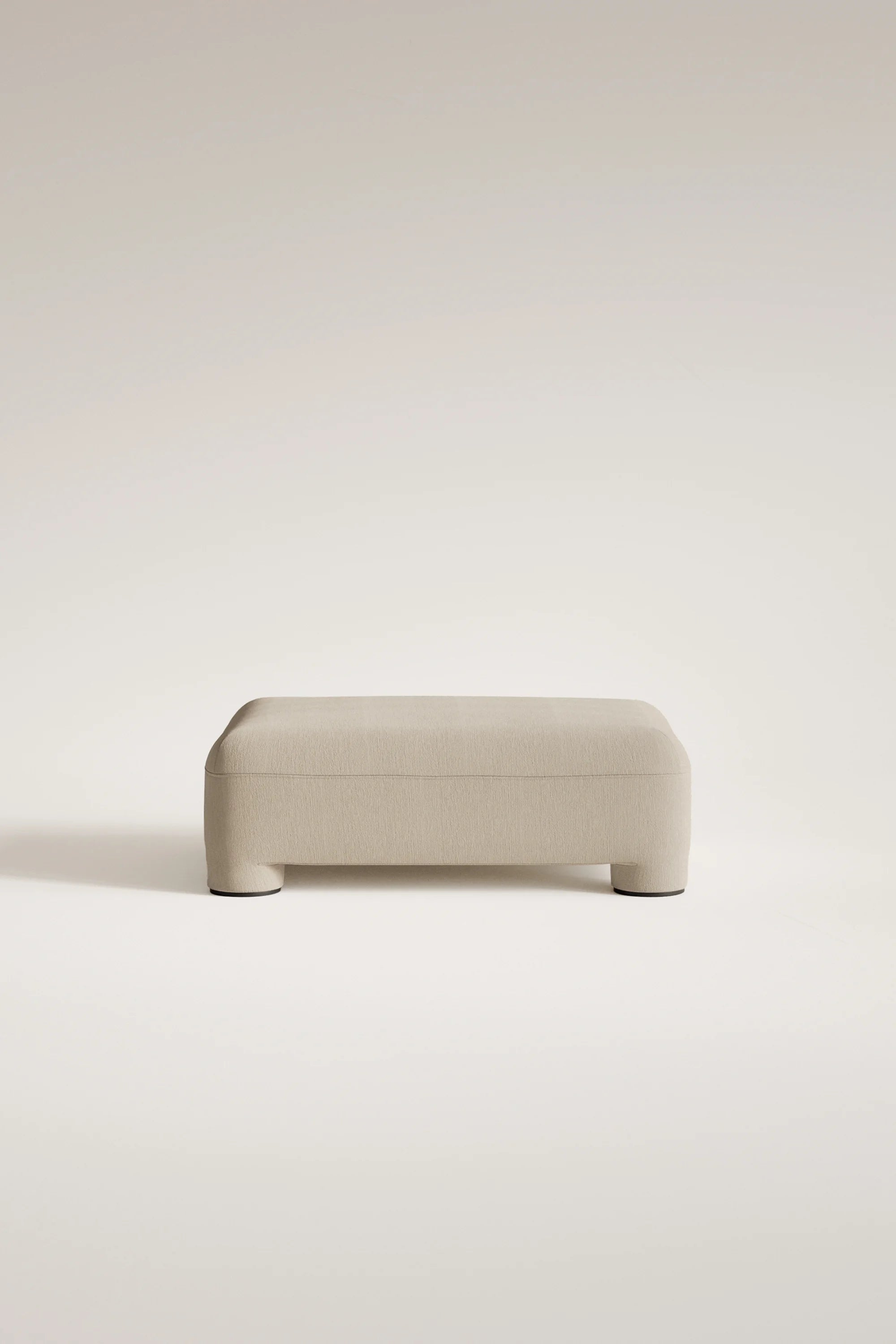 Beige ottoman on a light beige background