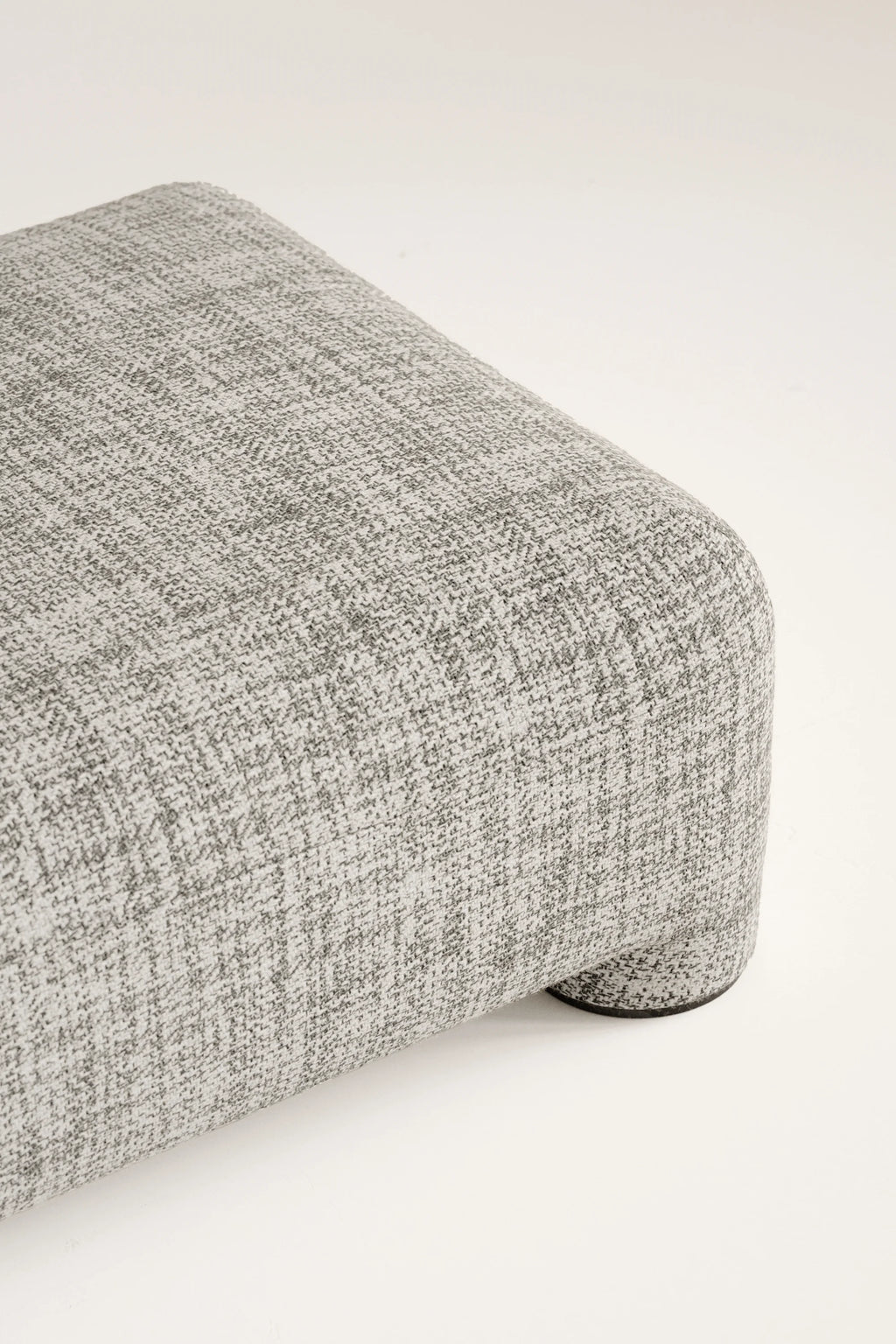 Gray textured ottoman on a white background