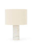 Table lamp with a cylindrical marble base and a beige lampshade on a white background