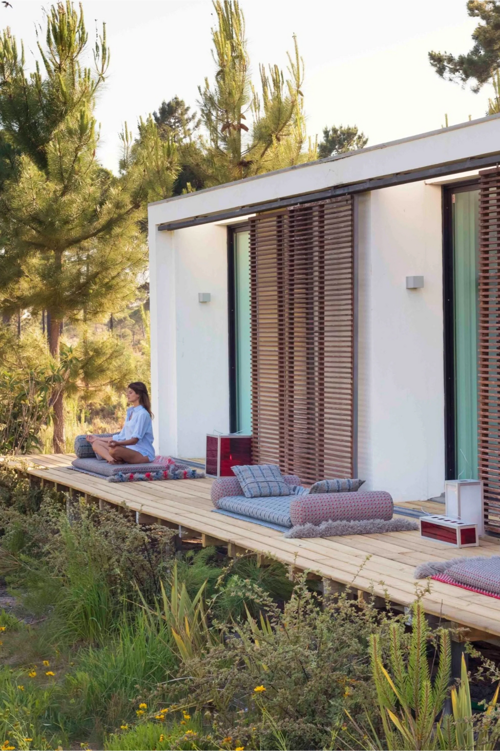 GAN Rugs Garden Layers Composition 06, a modular organic modern outdoor sofa and lounge collection featuring plush hand-woven fabric cushions in muted blues, greys, and reddish-pink tones with.
