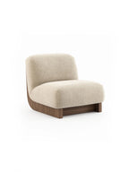 Laskasas Gandhi Lounge Chair, a low-profile organic modern accent chair featuring plush cream bouclé fabric upholstery with a rich dark walnut wood base and elegantly curved backrest. This contemporary armless design offers a minimalist silhouette and a cozy, textured finish. Perfect as a statement piece in a luxury living room, Japandi bedroom, or modern hotel lobby.