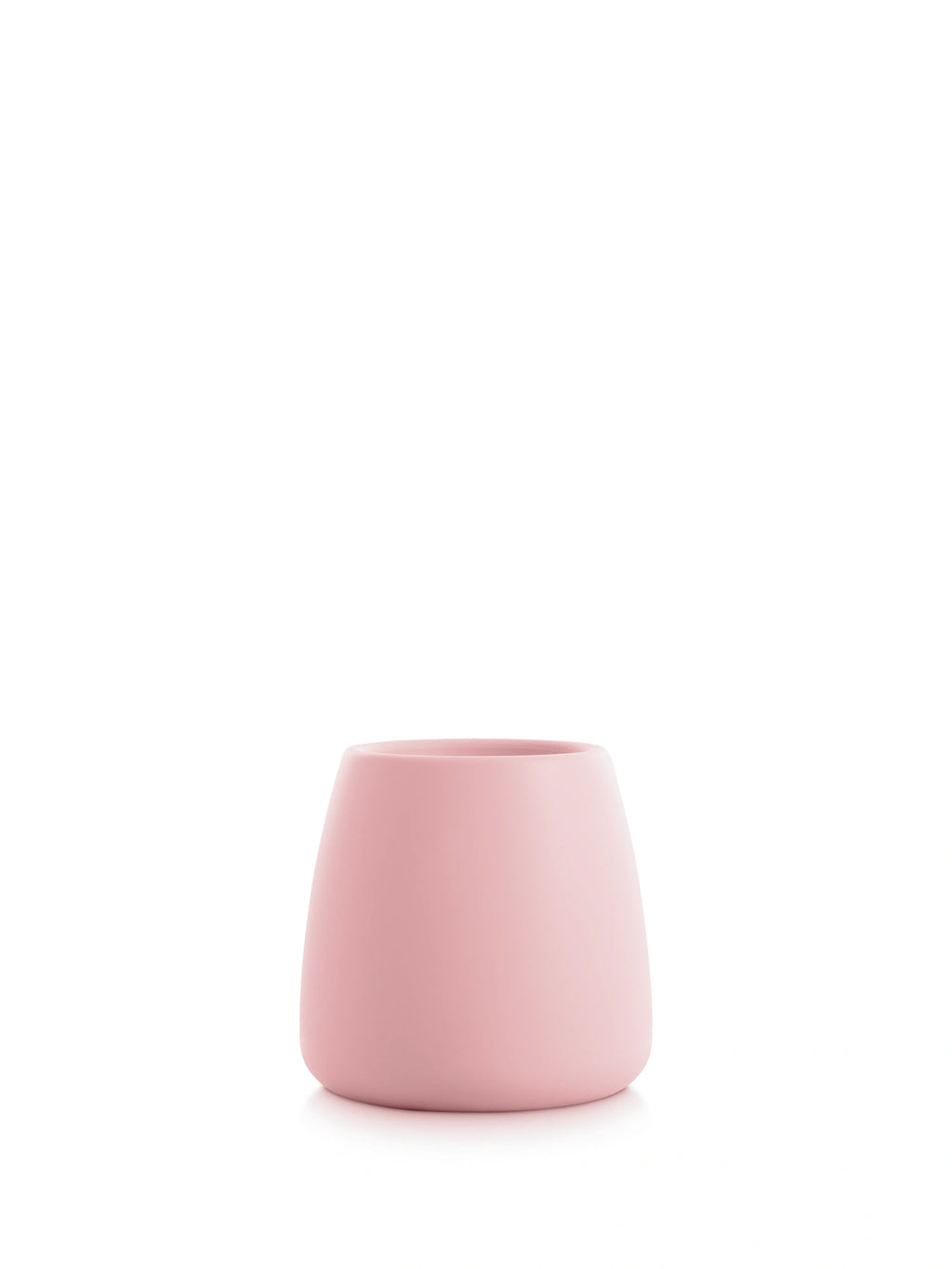 Diabla Gobi 1 Planter in soft pink, shown empty to emphasize its elegant, rounded shape and smooth, matte surface. This charming and modern planter adds a subtle pop of color to any decor, displayed on a clean white background.