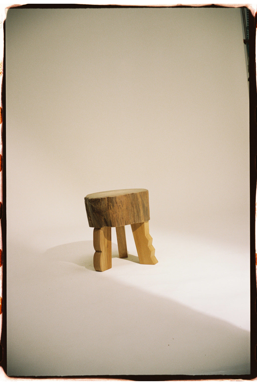 Heaps & Woods Luisa Stool, a handcrafted organic modern accent stool featuring a raw, natural wood log slice top with visible grain and warm, light wood tones.