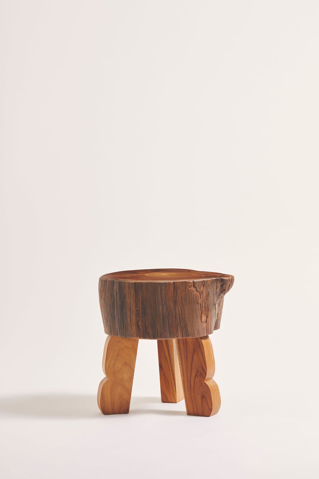 Heaps & Woods Luisa Stool, an organic modern accent stool featuring a dark brown solid wood tree trunk top with natural bark texture and prominent wood grain.