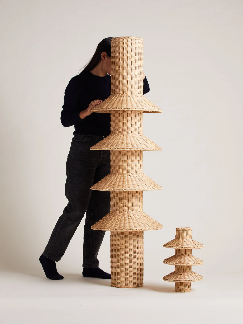 Heaps & Woods Rose Table Lamp, a natural woven rattan table lamp featuring a distinctive tiered sculptural design with stacked conical shades and a cylindrical base, showcasing its intricate hand-woven texture. This organic modern accent lamp is perfect for adding a touch of Japandi or Scandinavian style to living room consoles, bedroom nightstands, or entryway tables.
