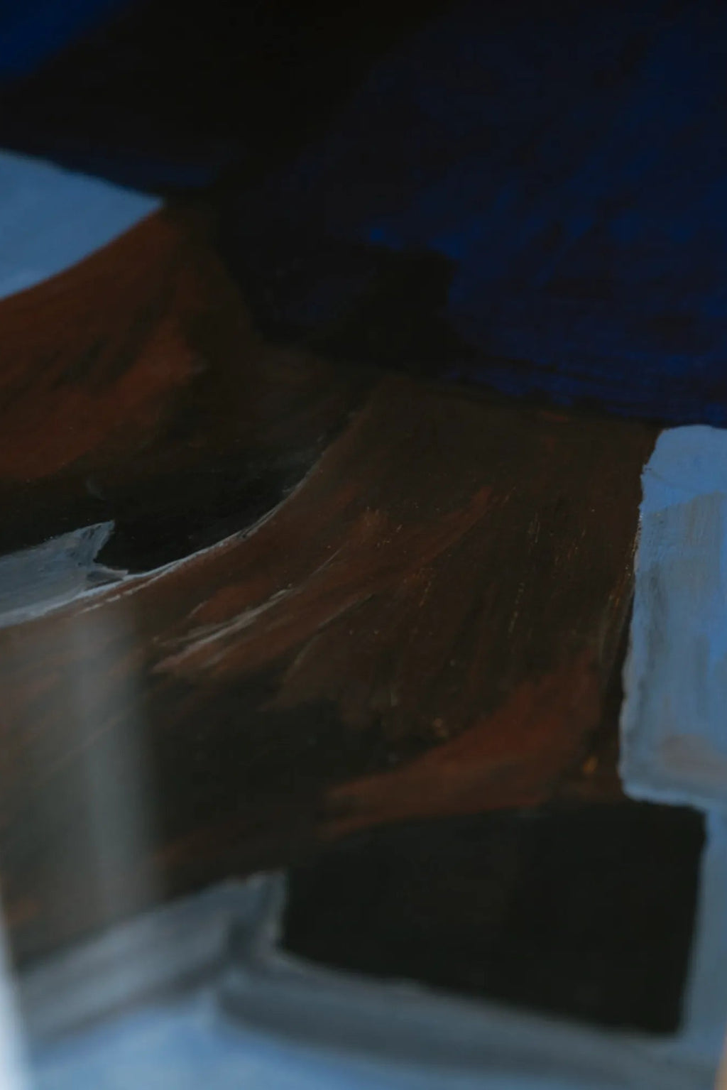 The Poster Club Boots and Blues, an abstract art print showcasing rich, painterly brushstrokes in deep navy blue, earthy rust brown, and subtle light blue and grey tones, forming a dynamic,.