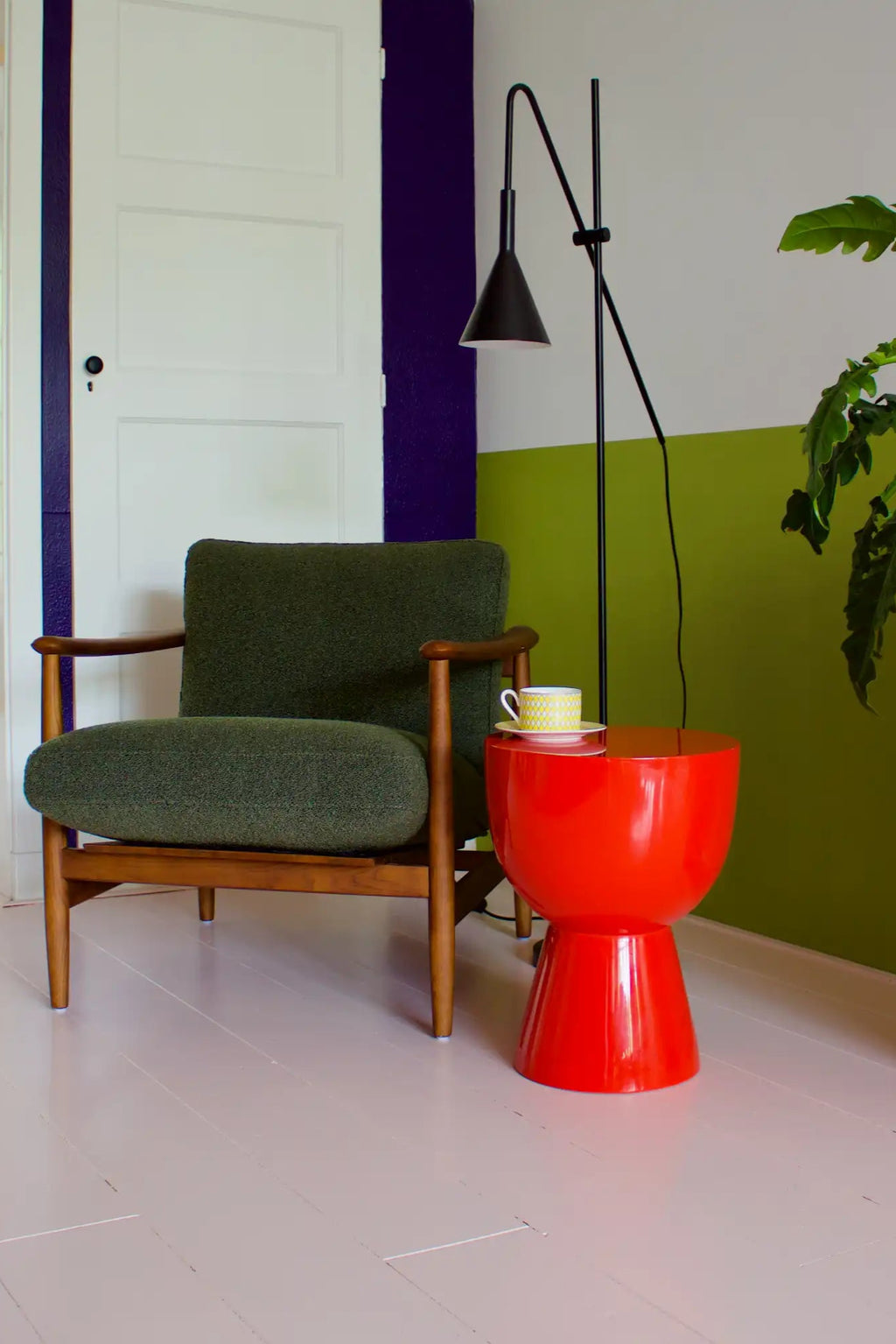 POLSPOTTEN Tip Tap Stool, a vibrant red lacquered stool with a high-gloss finish, featuring a distinctive hourglass silhouette with a wide, rounded top and a tapered conical base. This bold and sculptural piece functions as a playful side table or an eye-catching accent stool, perfect for contemporary living rooms, modern bedrooms, or entryways seeking a pop of color.