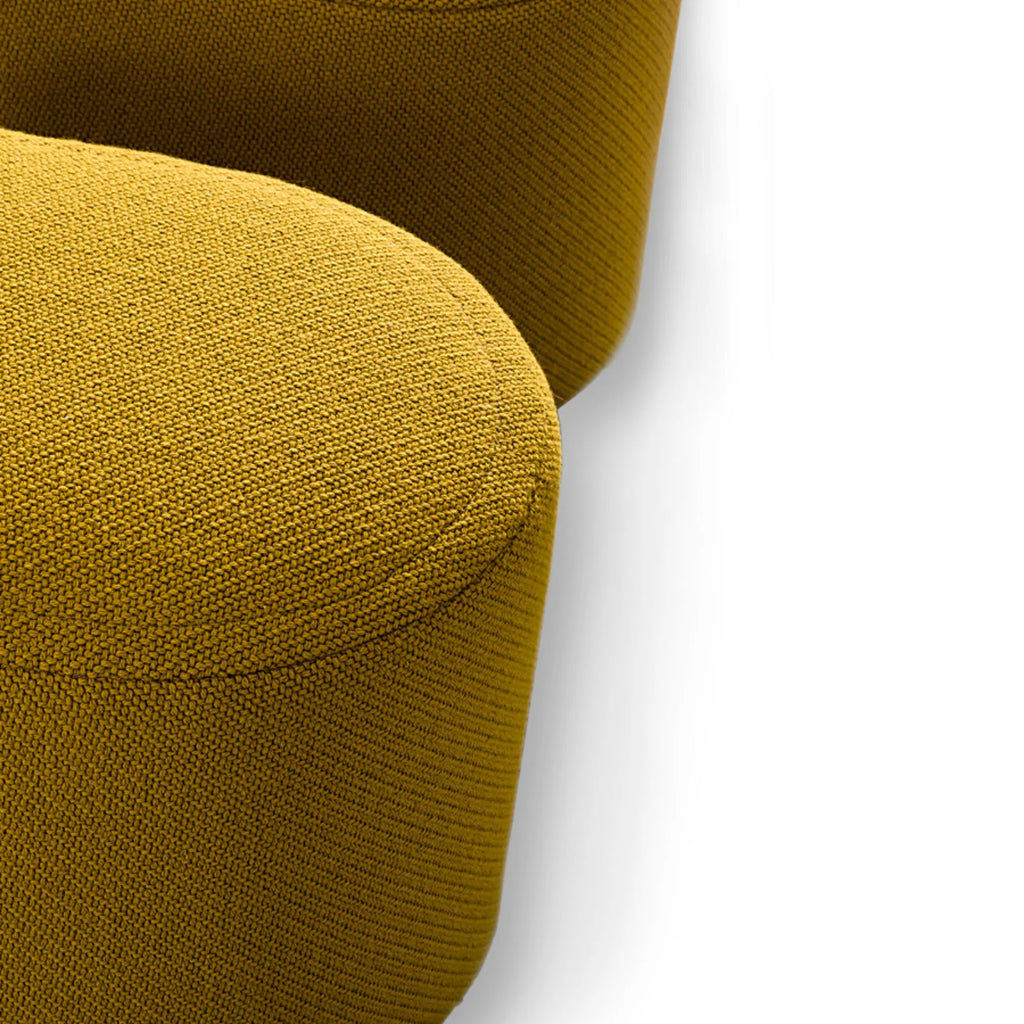 Hessentia Marilyn Pouf, a vibrant mustard yellow contemporary pouf featuring a plush, tightly knitted fabric upholstery and an inviting organic rounded shape. This versatile accent seating piece offers a soft, textured surface and modern appeal, perfect for comfort and style. Ideal for adding a pop of color to a living room, bedroom, or cozy reading nook in a modern minimalist or organic modern interior.