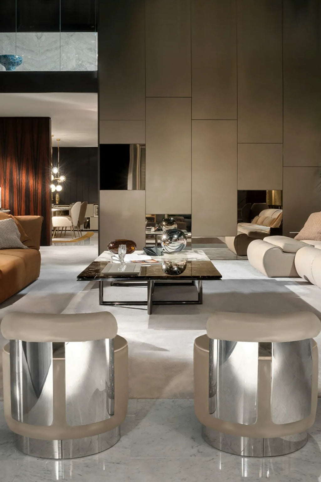 Hessentia Shelly Pouf, a luxurious contemporary accent stool featuring a polished chrome-plated metal base and internal vertical supports, encased in a translucent frosted acrylic barrel-shaped outer shell with.