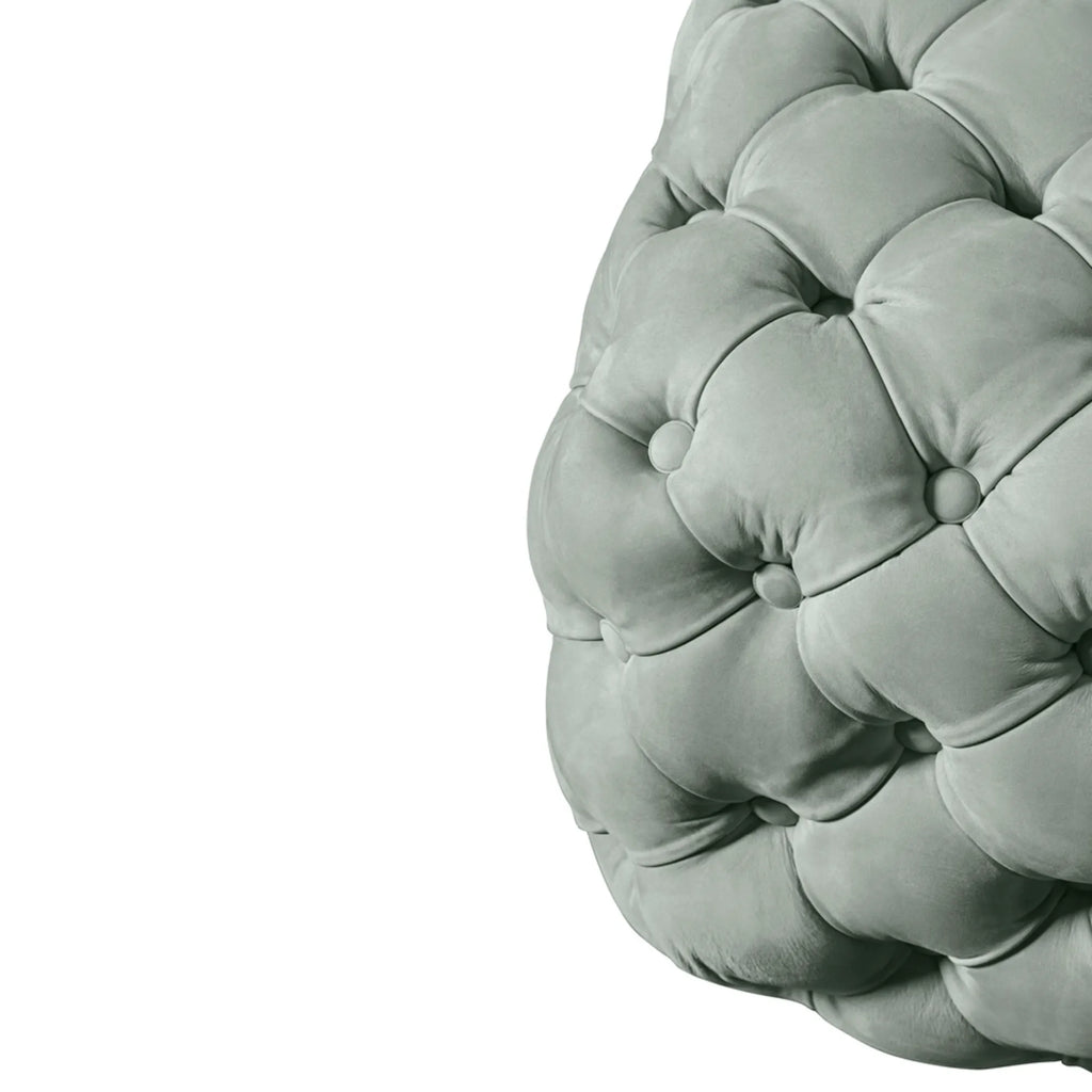 Hessentia Turtle Pouf, a luxurious sage green velvet tufted pouf featuring a deeply button-tufted surface and a plush, organic rounded shape. This contemporary upholstered ottoman, with its soft grey-green hue and rich texture, offers versatile seating or a stylish footrest. Perfect for adding an elegant accent to modern living rooms, cozy bedrooms, or chic lounge areas.