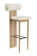 Wooden bar stool with white cushioned seat and backrest on a white background