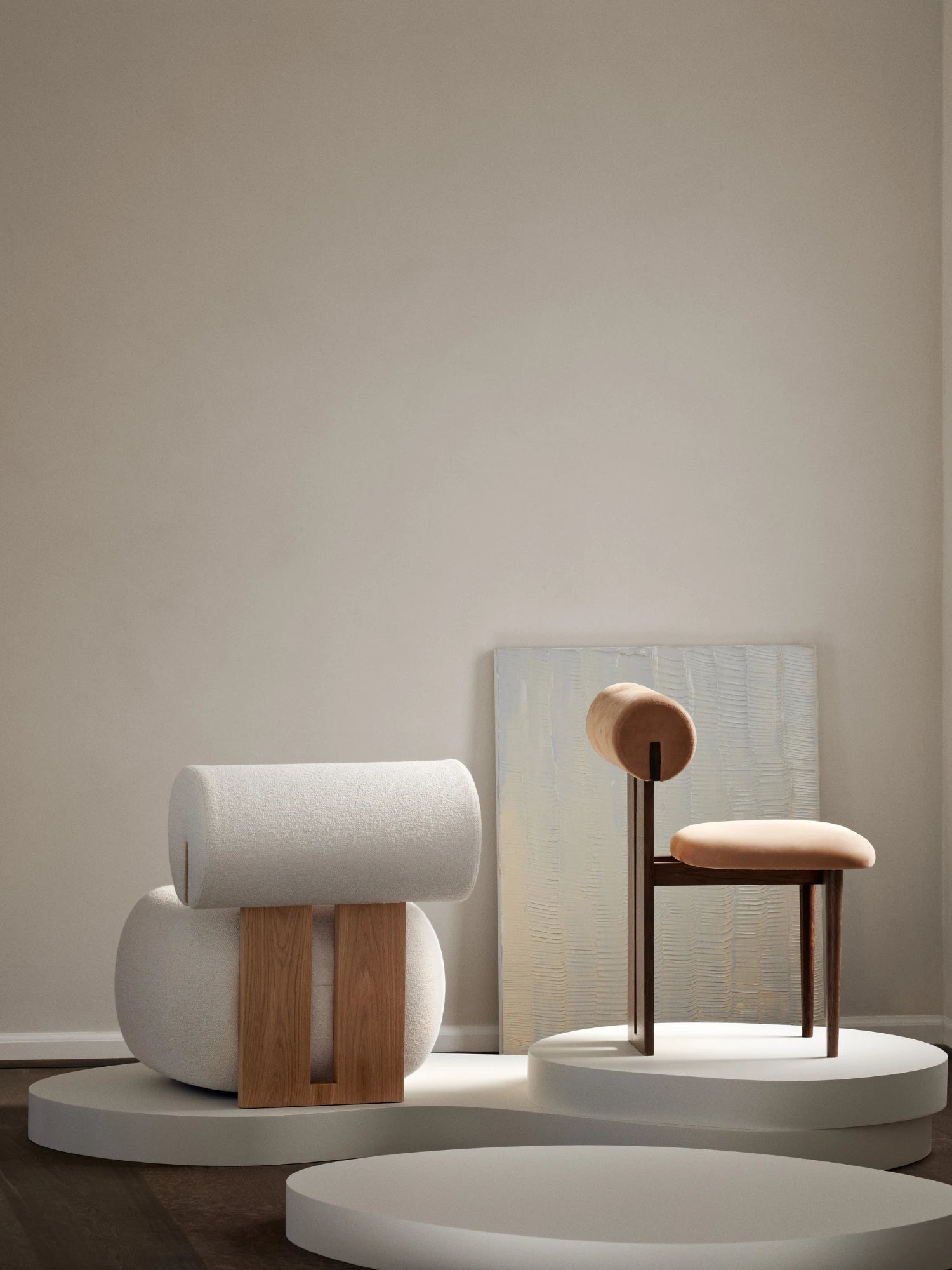 NORR11 Hippo Chair, a contemporary dining chair or accent chair featuring a dark brown solid wood frame with a distinctive rounded backrest and a plush, rounded seat, both upholstered in a soft peach velvet fabric. Its minimalist and sculptural design, characterized by organic modern lines, makes it a refined addition to modern dining rooms or sophisticated living spaces.