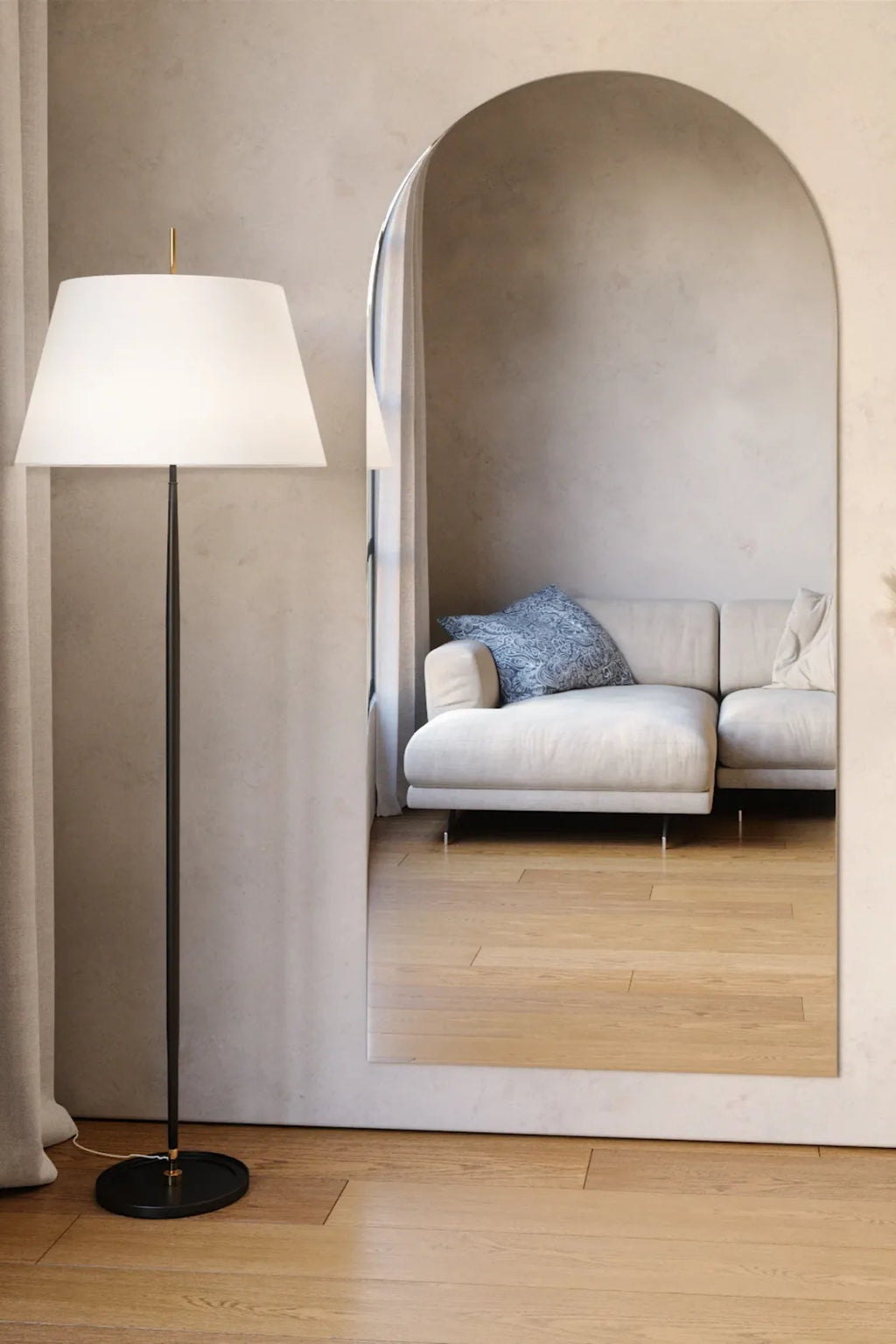 TCL Studios Arc Full Length Mirror, a large modern minimalist arched full-length mirror featuring a sleek frameless design and a tall, elegant silhouette. This contemporary arch-top floor mirror offers a clean reflection and expands any space with its organic modern aesthetic. Ideal as a stylish dressing mirror for bedrooms, a welcoming accent in entryways, or a sophisticated statement piece for living rooms.