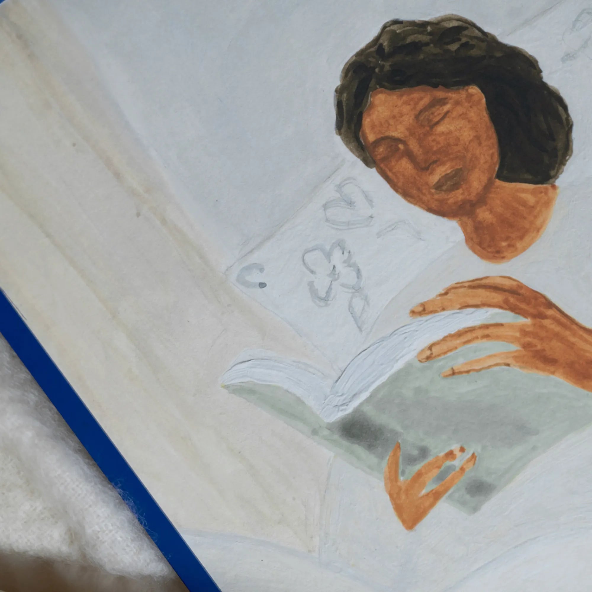  Close-up of Morning Read product with a stack of books and a pair of reading glasses on a wooden table