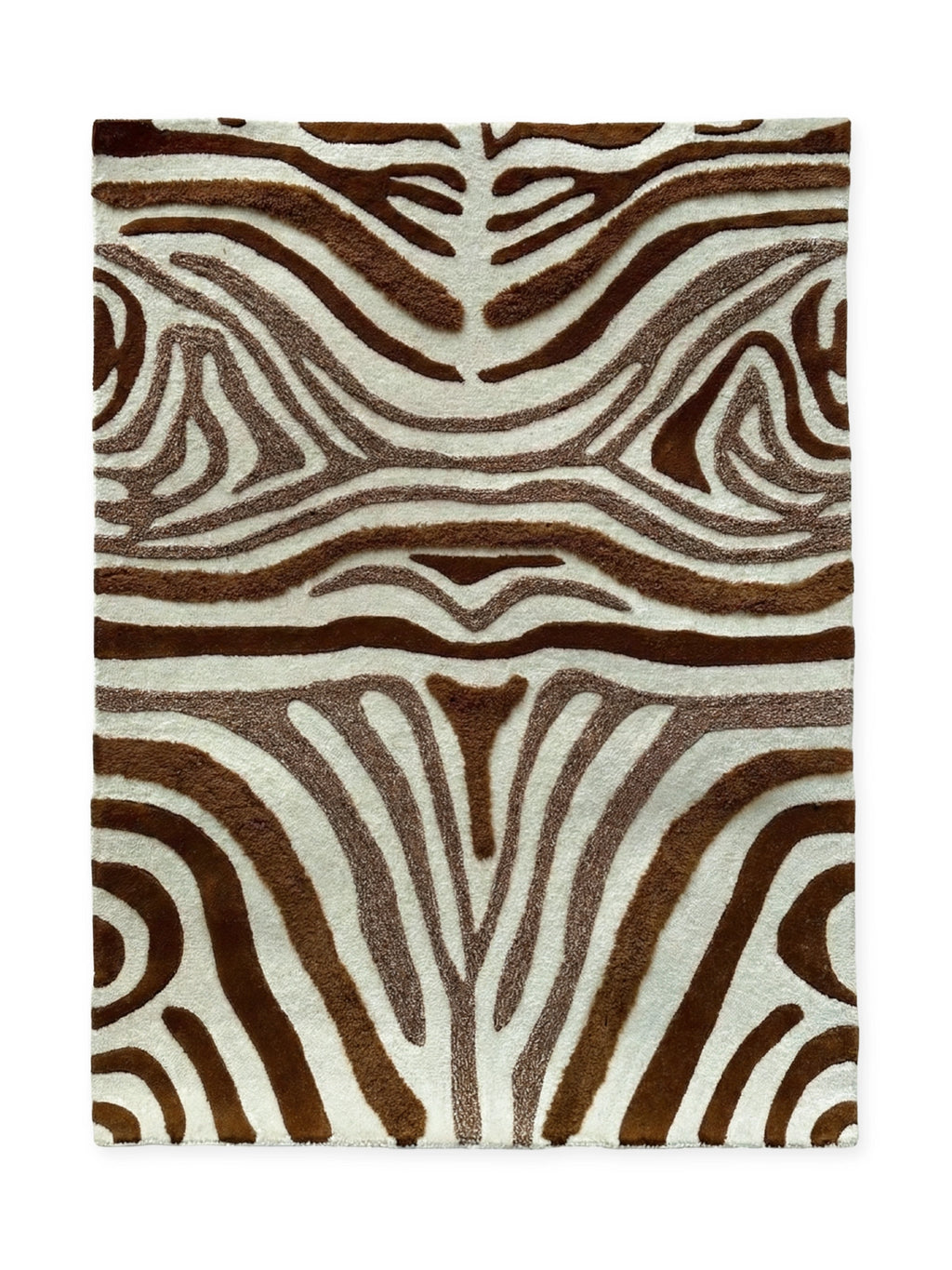 Tinted Objects Jepson Wool Rug, featuring a bold brown and cream zebra stripe pattern with varying pile heights for a textured, plush feel. This stylish area rug is perfect for adding a touch of modern luxury and visual interest to a living room, bedroom, or entryway for design-conscious homeowners.