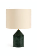 Table lamp with green marble base and beige lampshade on a white background