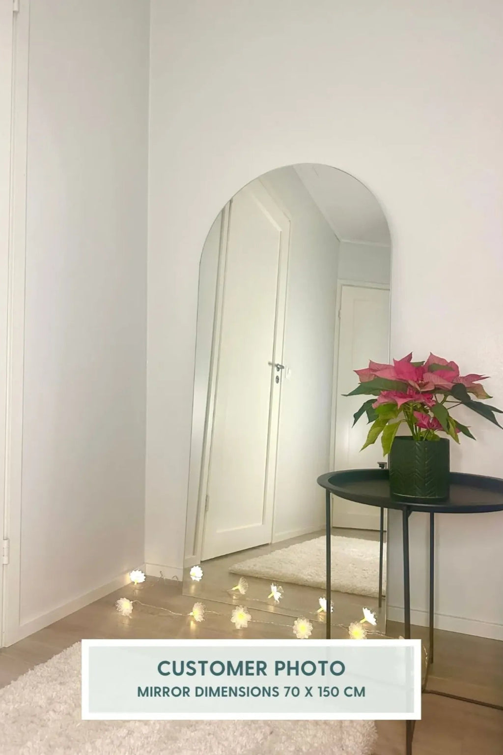 TCL Studios Arc Full Length Mirror, a modern frameless arched mirror with a sleek, minimalist design and smooth, reflective surface.