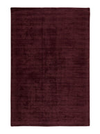 Dark purple rug on a white background