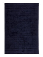 Navy blue rug on a white background