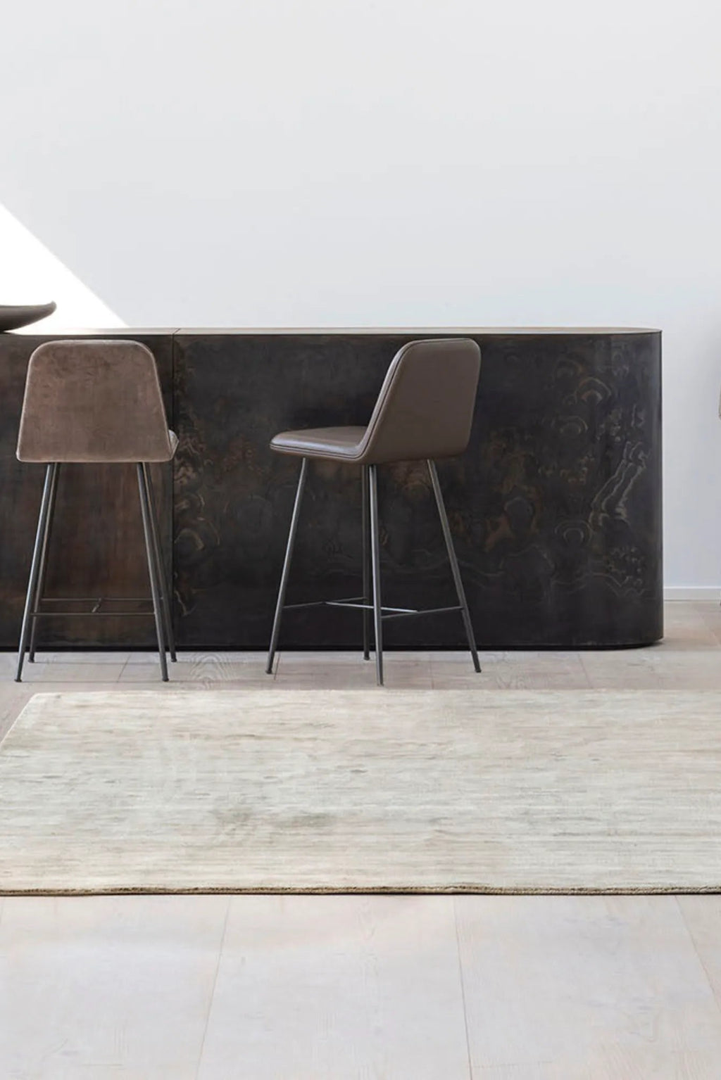 Hand-woven ivory Karma Rug with intricate geometric patterns and tassels 