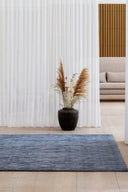  Spacious living room with a stylish and modern Karma Rug as the centerpiece 