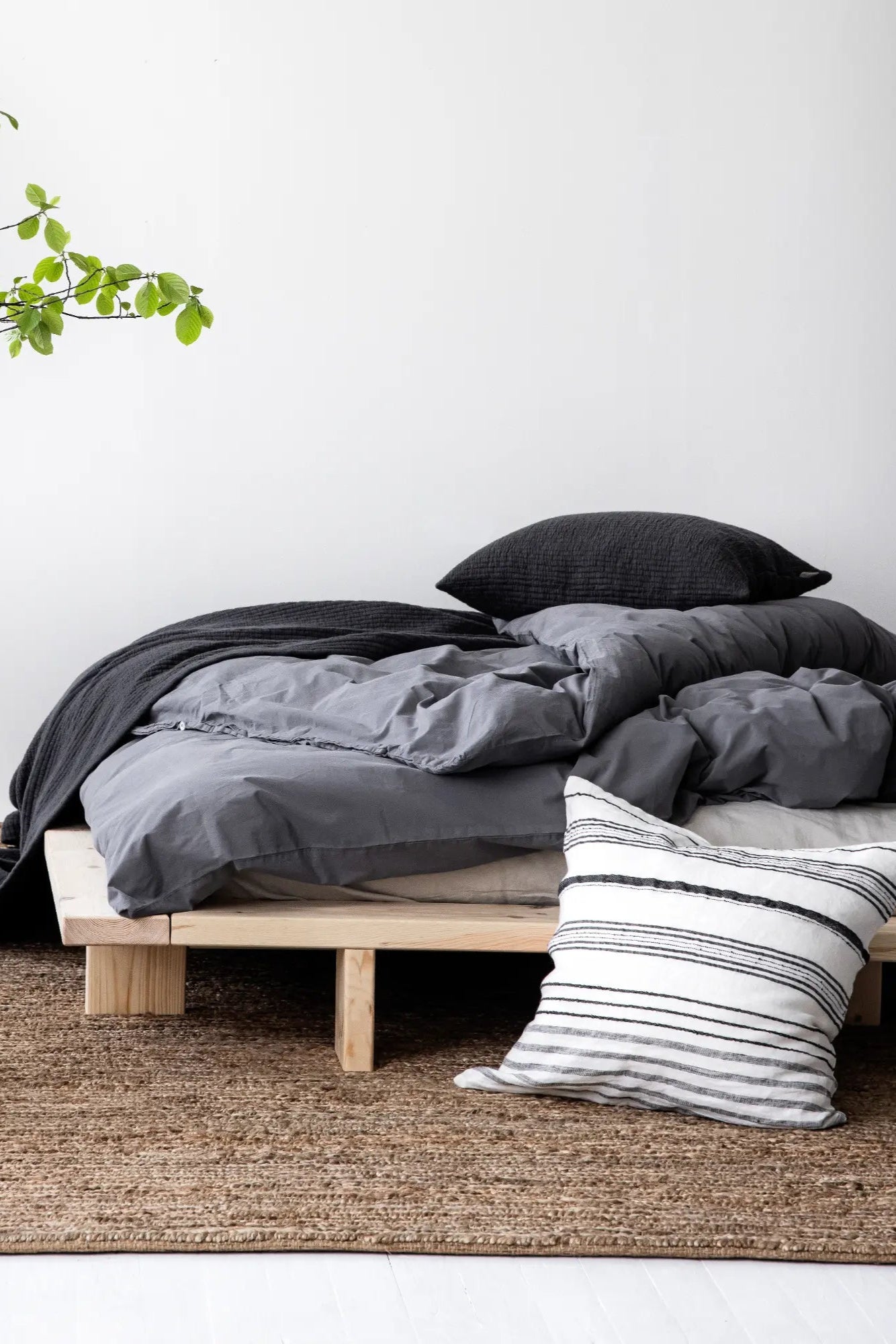 Solid wood Japan Bed with a raw, natural finish, perfect for a minimalist bedroom aesthetic