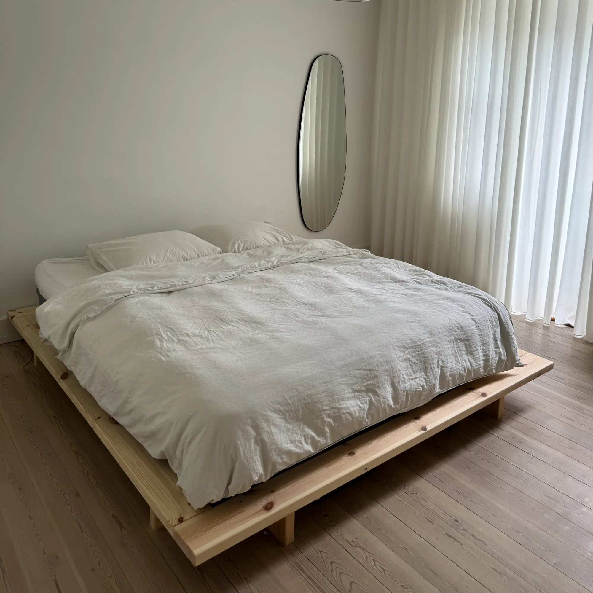 A traditional Japanese-style bed made of raw, natural materials