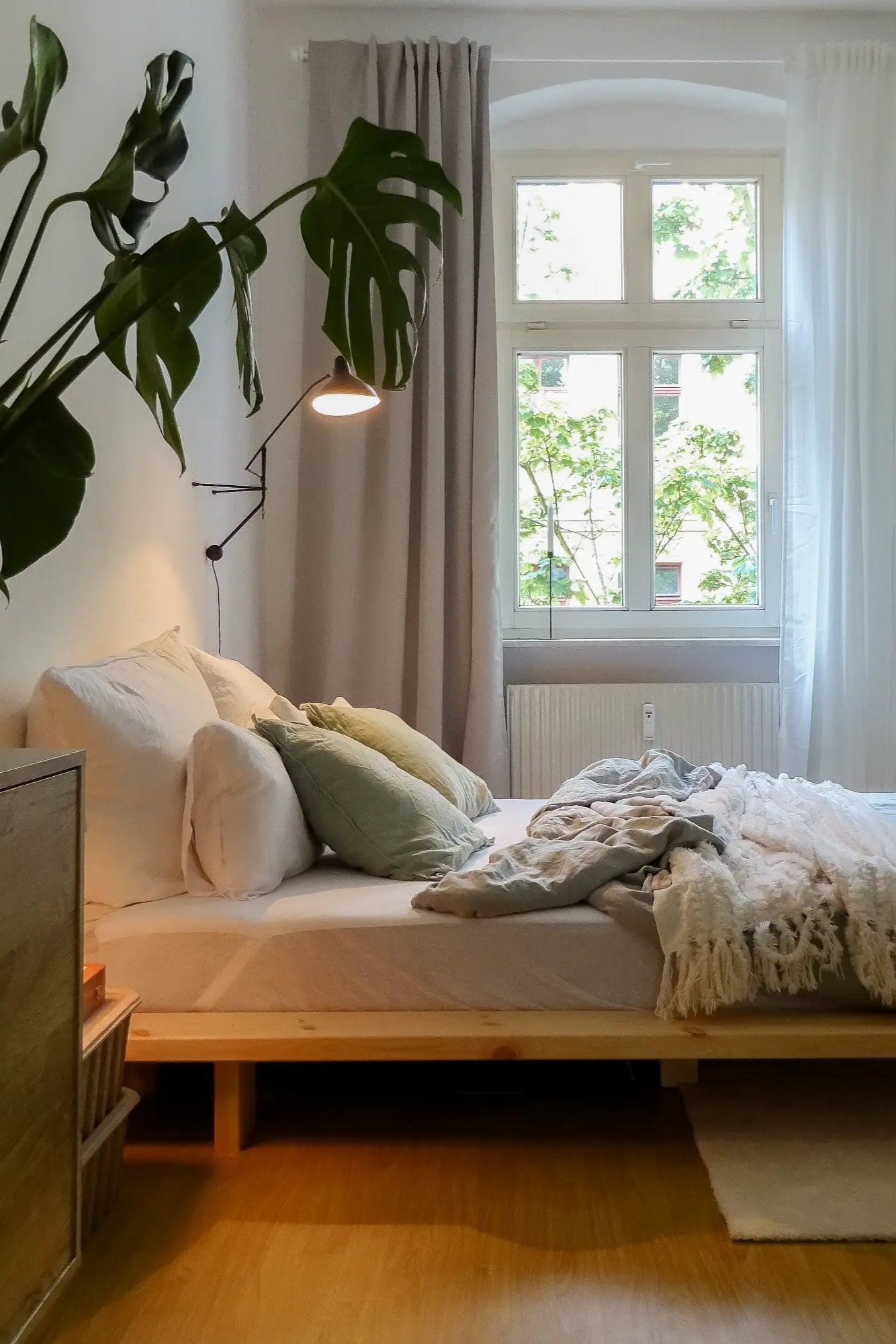 A traditional Japanese-style bed made from raw wood, featuring a low, minimalist design and clean lines for a serene and natural sleeping space