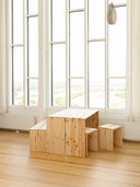 join-in dining table karup design in a room with big windows that bring alot of natural light